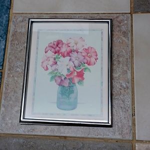 Floral print approximately 8"x10" in silver metal frame